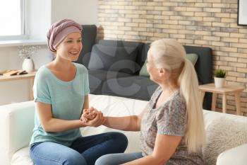 Mother with her daughter after chemotherapy at home�