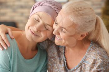 Mother with her daughter after chemotherapy at home�