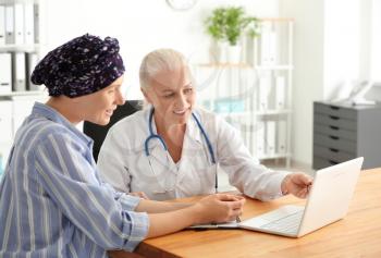 Woman after chemotherapy visiting doctor in hospital�