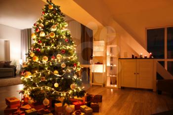 Beautiful Christmas tree with gifts in living room�