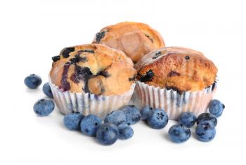 Tasty blueberry muffins on white background�