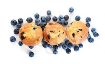 Tasty blueberry muffins on white background�