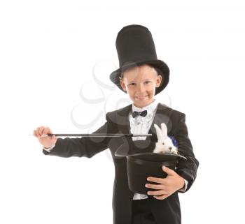 Cute little magician holding hat with rabbit on white background�