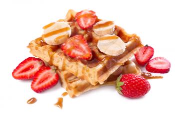 Delicious waffles with strawberry and banana on white background�