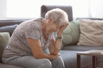 Depressed elderly woman at home�