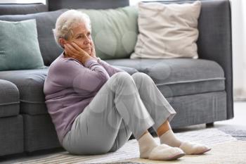 Depressed elderly woman at home�