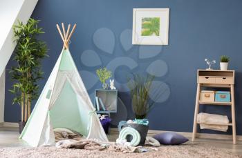 Cozy play tent for kids in interior of room�