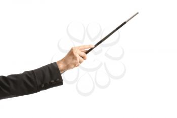 Hand of illusionist with magic wand on white background�
