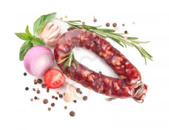 Composition with smoked sausage on white background�