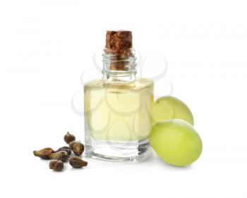 Bottle with grape seed oil on white background�