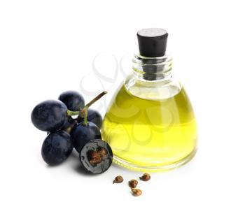 Bottle with grape seed oil on white background�