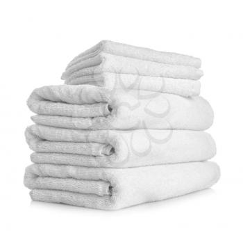 Stack of clean towels on white background�