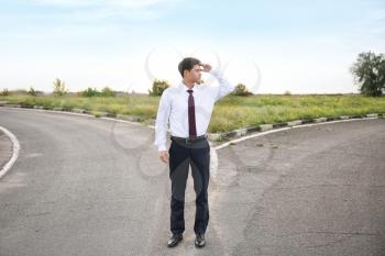 Businessman standing at crossroads. Concept of choice�