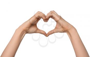 Woman making heart with her hands on white background�