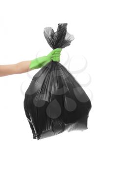 Woman holding garbage bag on white background�