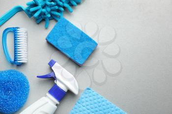 Cleaning supplies on grey background�