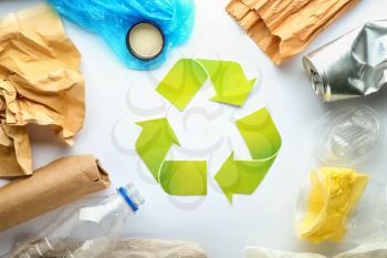 Different garbage with symbol of recycling on white background. Ecology concept�