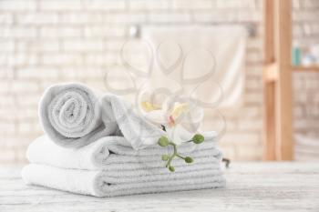 Towels with flowers on light table�