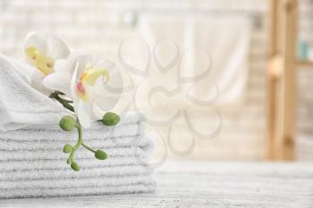 Towels with flowers on light table�