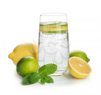 Glass of water with lemon, lime and mint on white background�