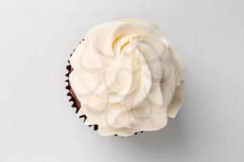 Tasty cupcake on white background�