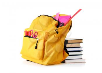 Backpack with school supplies on white background 