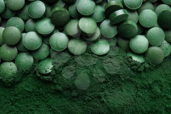 Spirulina tablets with powder, top view�