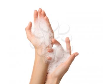 Female hands with soap foam on white background�