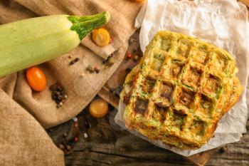 Stack of tasty squash waffles on wooden table�
