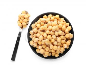 Bowl and spoon with chickpeas on white background�