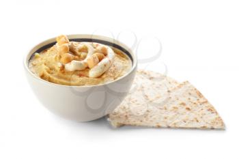 Bowl with tasty hummus and lavash on white background�