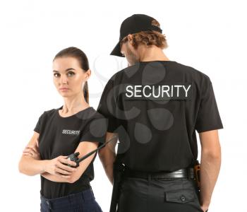 Male and female security guards on white background�