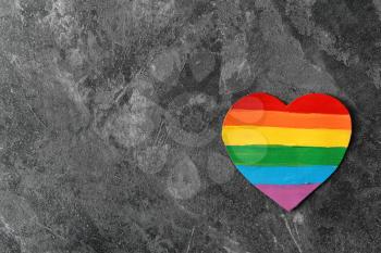 Rainbow heart shaped painting of  LGBT on grey background�