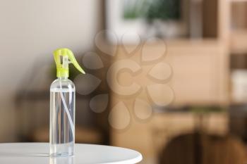 Aromatic air freshener on table in room�