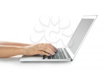 Woman using laptop on white background�