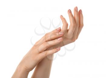 Female hands with nude manicure on white background�