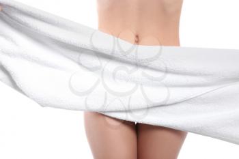 Beautiful young woman with towel on white background. Hair removal concept�