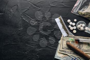 Drugs, cigar and money on dark background. Concept of addiction�