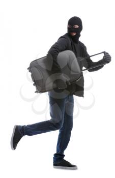 Male thief with suitcase on white background�