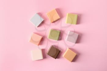 Handmade soap bars on color background, flat lay�