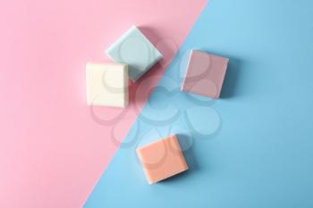 Handmade soap bars on color background, flat lay�