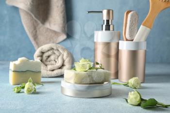 Soap and bathing accessories on table�
