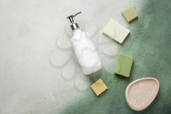 Liquid and solid soap on light background�