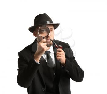 Detective with magnifying glass on white background�