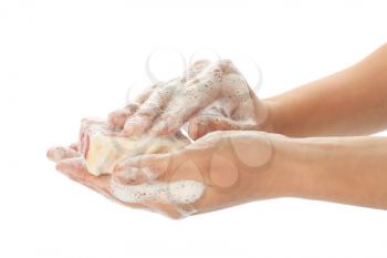 Female hands with soap on white background�