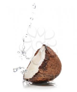 Half of fresh coconut with water splash on white background�