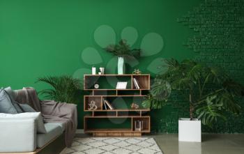 Green tropical plants in interior of room�
