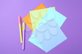 Paper stickers and felt-pens on color background�