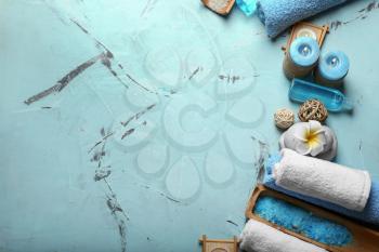 Composition with spa accessories and cosmetics on color background�