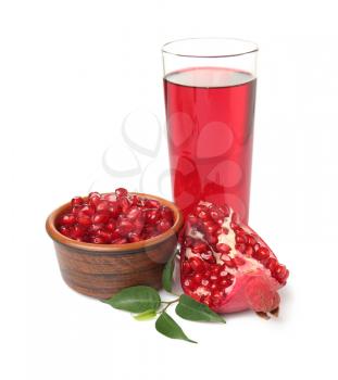 Glass of pomegranate juice and bowl with seeds on white background�
